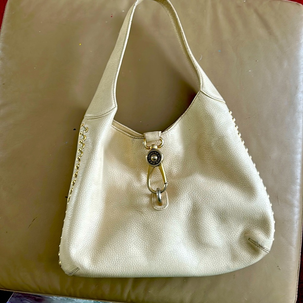 Beautifully crafted cream coloured leather bag by Dooney & Bourque